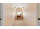 Hallway with desk and arch window allowing great light at 8912 Riverview Park Dr, Raleigh, NC 27613