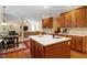 A kitchen island with a sink overlooks the living room in this home's open-concept floor plan at 8912 Riverview Park Dr, Raleigh, NC 27613