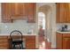 A desk overlooks the kitchen and dining room in this open floor plan at 8912 Riverview Park Dr, Raleigh, NC 27613