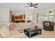 An open-concept living room is flooded with natural light and opens to the kitchen at 8912 Riverview Park Dr, Raleigh, NC 27613
