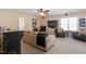 Living room with a sofa, a tv, two armchairs, and a wet bar at 8912 Riverview Park Dr, Raleigh, NC 27613