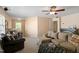 Living room with multiple sofas, a bar area, and a window at 8912 Riverview Park Dr, Raleigh, NC 27613