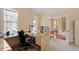 Bright home office with large windows and a desk, offering an ideal space for productivity and study at 8912 Riverview Park Dr, Raleigh, NC 27613