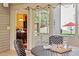 Cozy outdoor patio with a round table, comfortable seating, and string lights at 8912 Riverview Park Dr, Raleigh, NC 27613