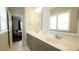 Bathroom features double sinks, vanity, and natural light at 100 E Delafield Ave, Durham, NC 27704