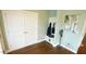 Entryway with storage niche, coat hooks, closet at 100 E Delafield Ave, Durham, NC 27704