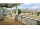 Covered front porch featuring sturdy white railings with brick column bases and exterior view at 100 E Delafield Ave, Durham, NC 27704