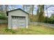 Rustic backyard shed or garage with weathered gray paint and a decorative star at 100 E Delafield Ave, Durham, NC 27704