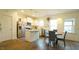 Bright, open kitchen featuring stainless steel appliances, an island, and a dining nook at 100 E Delafield Ave, Durham, NC 27704