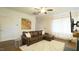 Spacious living room featuring a leather couch, fireplace, and neutral decor at 100 E Delafield Ave, Durham, NC 27704