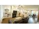 Open living room features a fireplace with built-ins and views of the kitchen at 100 E Delafield Ave, Durham, NC 27704