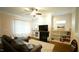 Comfortable living room features a fireplace, built-in bookshelves, and neutral accents at 100 E Delafield Ave, Durham, NC 27704