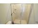 Tiled shower with glass door at 100 E Delafield Ave, Durham, NC 27704