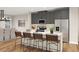 Contemporary kitchen with stainless steel appliances, gray cabinets, and a breakfast bar at 1013 Regalia Rd # 28, Durham, NC 27713