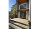 Stylish back porch with wood flooring, modern lighting, and views of the private backyard at 103 Inara Ct, Carrboro, NC 27510