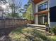Backyard featuring a modern exterior, cozy deck, and privacy fencing at 103 Inara Ct, Carrboro, NC 27510