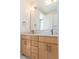 Bathroom featuring double vanity, modern faucets, and a large mirror at 103 Inara Ct, Carrboro, NC 27510