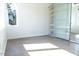 Bedroom with sliding glass closet doors, shelving, and a window at 103 Inara Ct, Carrboro, NC 27510