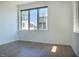 Bright bedroom featuring hardwood floors, large window, and a neutral color palette at 103 Inara Ct, Carrboro, NC 27510