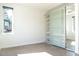 Bedroom featuring hardwood floors, large window, and a modern mirrored closet at 103 Inara Ct, Carrboro, NC 27510