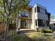 Contemporary home with a wooden porch, large windows, and sleek design, surrounded by lush greenery at 103 Inara Ct, Carrboro, NC 27510