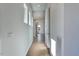Light and bright hallway with hardwood floors and neutral paint at 103 Inara Ct, Carrboro, NC 27510