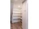 Storage space with shelving and access panel in the floor, maximizing utility of the area at 103 Inara Ct, Carrboro, NC 27510