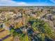 Aerial view of a neighborhood with lush trees and a clear blue sky at 109 Hardee St, Clayton, NC 27520