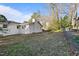 Spacious backyard features a white brick home with fencing at 109 Hardee St, Clayton, NC 27520