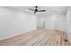 Neutral bedroom is filled with modern wood flooring and a ceiling fan at 109 Hardee St, Clayton, NC 27520