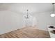 Bright dining area featuring modern light fixtures and durable flooring at 109 Hardee St, Clayton, NC 27520