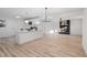 Modern kitchen featuring an island and a view to the living room at 109 Hardee St, Clayton, NC 27520