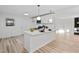 Bright kitchen features a center island, new appliances, and modern lighting at 109 Hardee St, Clayton, NC 27520