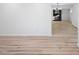 Open-concept living room features light wood flooring and a modern fireplace at 109 Hardee St, Clayton, NC 27520