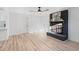 Cozy living room with a painted fireplace and ceiling fan at 109 Hardee St, Clayton, NC 27520