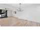 Spacious living room with a decorative fireplace and modern chandelier at 109 Hardee St, Clayton, NC 27520