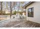 Expansive back deck overlooking a private backyard surrounded by mature trees, perfect for relaxing at 1201 Deerfield Dr, Cary, NC 27511