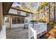 Exterior showing a deck and backyard surrounded by lush trees providing shade and privacy at 1201 Deerfield Dr, Cary, NC 27511