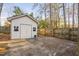 Backyard storage shed with double doors and concrete pad at 1201 Deerfield Dr, Cary, NC 27511