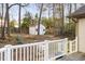 Fully fenced backyard featuring a storage shed, lush trees, and privacy from neighbors at 1201 Deerfield Dr, Cary, NC 27511