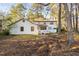 Spacious backyard view of home featuring a white deck and partial wood fencing at 1201 Deerfield Dr, Cary, NC 27511