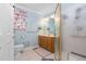 Bathroom featuring a vanity, shower, toilet, and pastel blue walls at 1201 Deerfield Dr, Cary, NC 27511