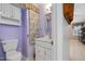 Bright bathroom featuring a white vanity, decorative mirror, and floral shower curtain detail at 1201 Deerfield Dr, Cary, NC 27511