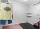 Walk-in closet with shelving, clothing, and carpet at 1201 Deerfield Dr, Cary, NC 27511