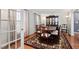 Elegant dining room featuring hardwood floors, a china cabinet, and a large table for entertaining at 1201 Deerfield Dr, Cary, NC 27511