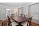 A formal dining room features a large table, ornate chairs, and bright natural lighting at 1201 Deerfield Dr, Cary, NC 27511