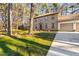 Brick home with a well-manicured lawn and mature trees at 1201 Deerfield Dr, Cary, NC 27511