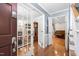 Welcoming foyer with hardwood floors, featuring glass paneled doors and views into multiple rooms at 1201 Deerfield Dr, Cary, NC 27511