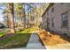 Brick home with mature trees and a manicured lawn, offering a serene setting at 1201 Deerfield Dr, Cary, NC 27511