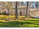 Brick home with a well-manicured lawn and mature trees at 1201 Deerfield Dr, Cary, NC 27511
